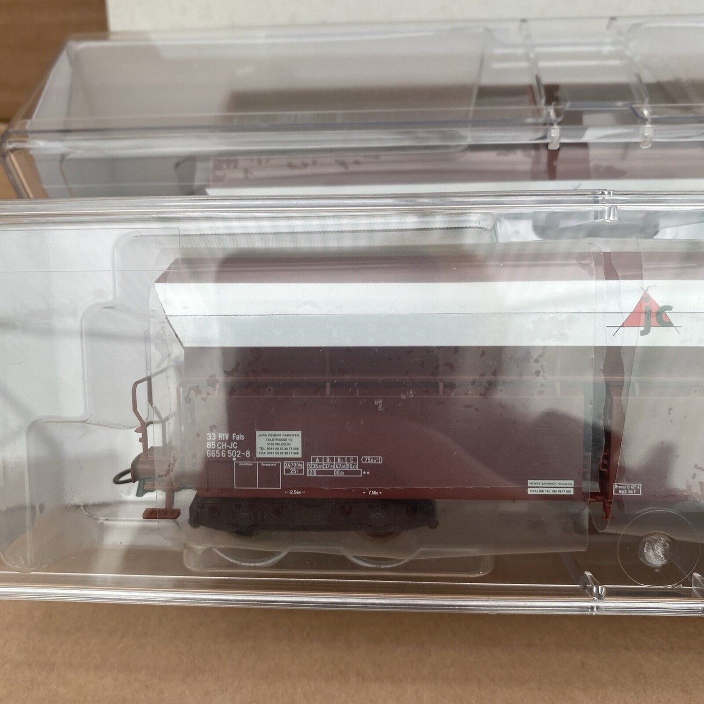 67023 Roco- 2-piece set of bulk wagons of the Jura Cement Fabriken AG